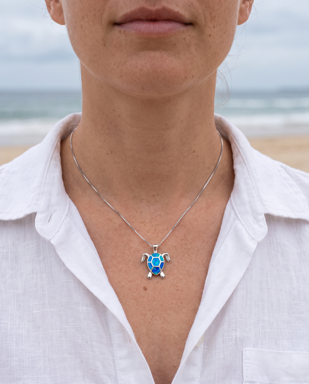 Sea Turtle necklace worn, shown at true size