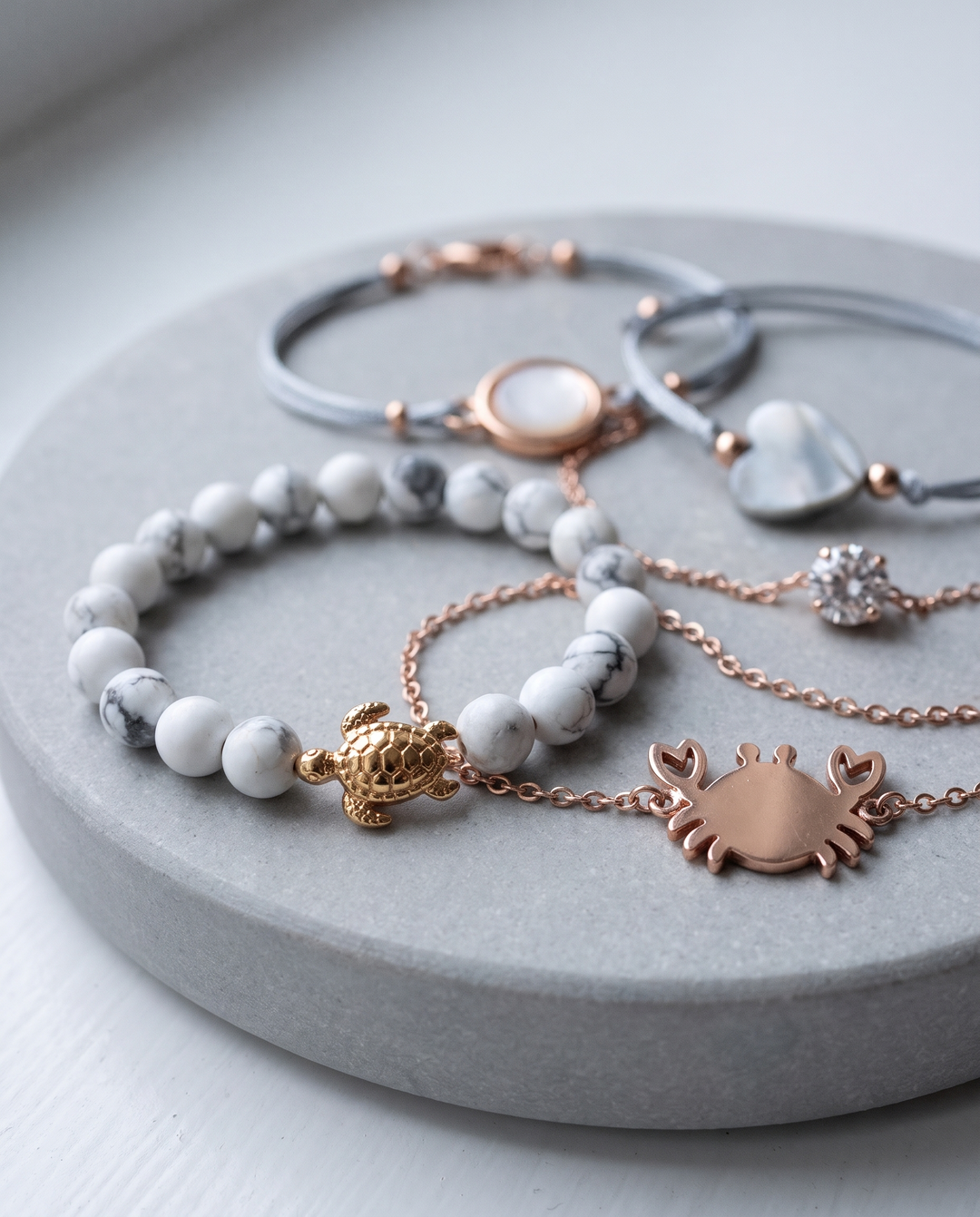 Oceana-5 bracelet set on grey stone