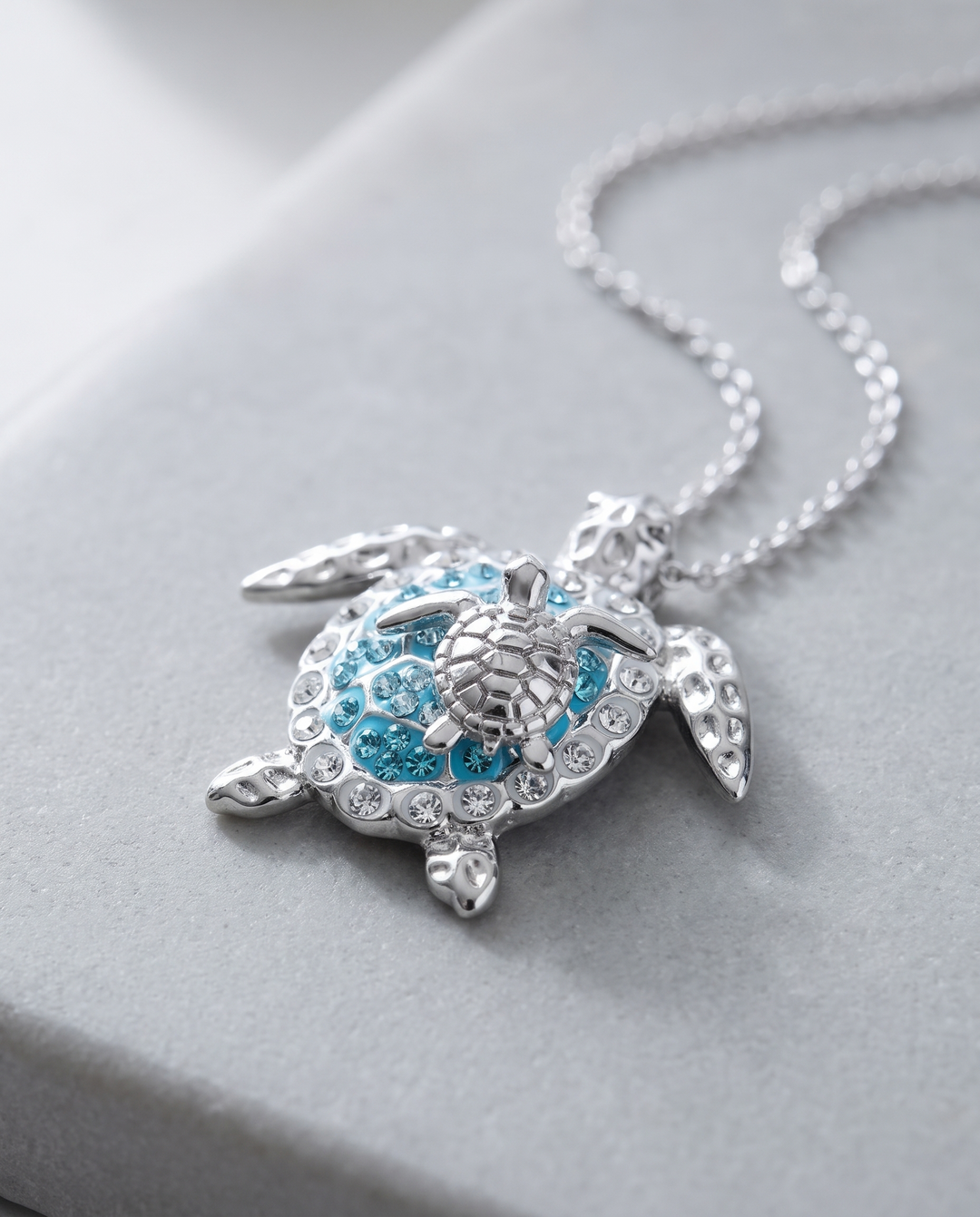 Turtle Mother and Baby Necklace on grey stone
